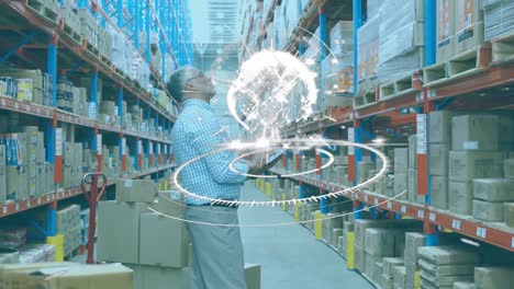 globe over a round scanner against caucasian senior male supervisor checking stock at warehouse