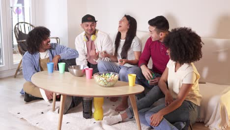 diverse group of friends laughing and enjoying a casual home gathering