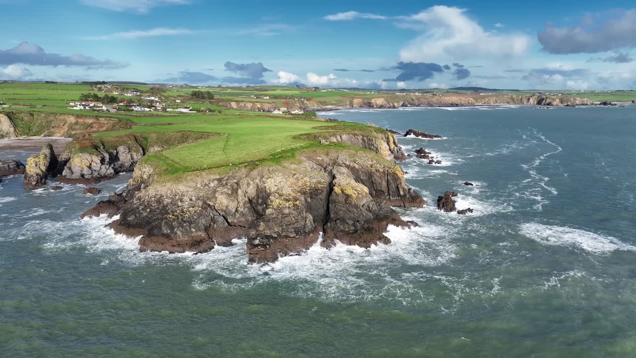 Ireland Epic Locations drone flying slowly to Dunabrattin Head in aftermath of a winter storm Copper Coast Waterford