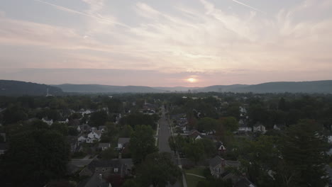 sunrise over suburban town
