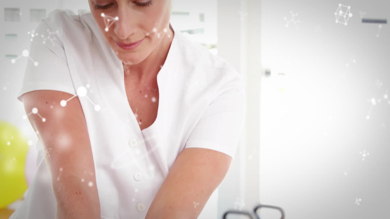 Animation of molecules over caucasian female physiotherapist with patient