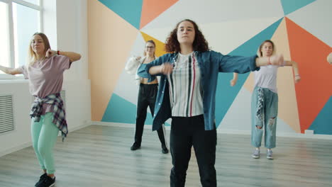 teen girls practicing dance in a studio