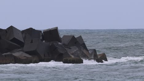 sequential wave impacts against coastal defenses