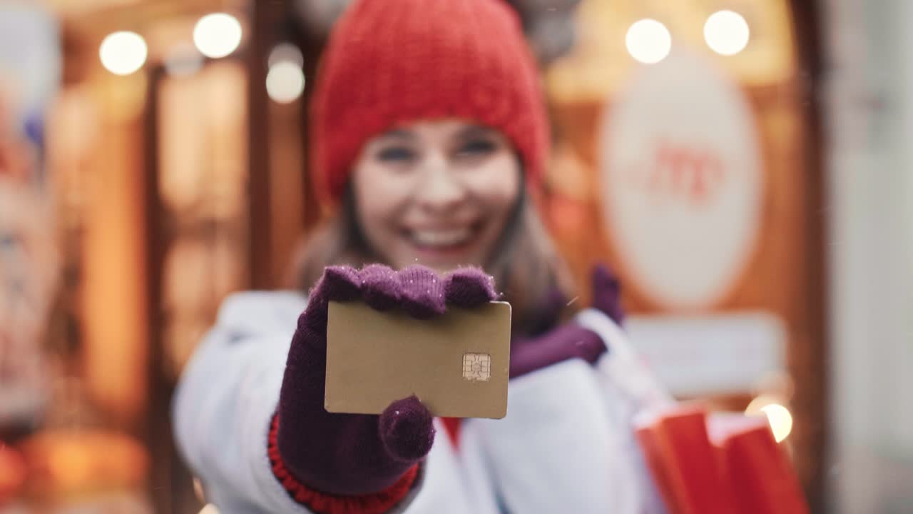 Woman's hand giving credit card with copy space