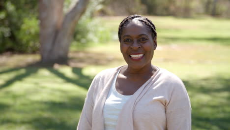 african american woman in the countryside walks into focus