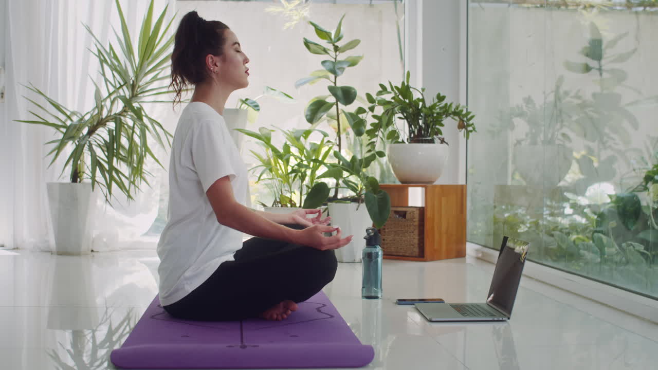 Caucasian Woman Meditating on Floor in Lotus Pose