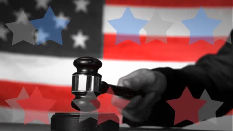 composite video of multiple star icons against hand banging a gavel against american flag background