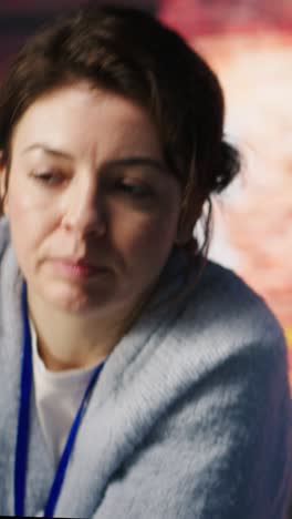 Vertical video Call center manager doing training for worker providing live chat support