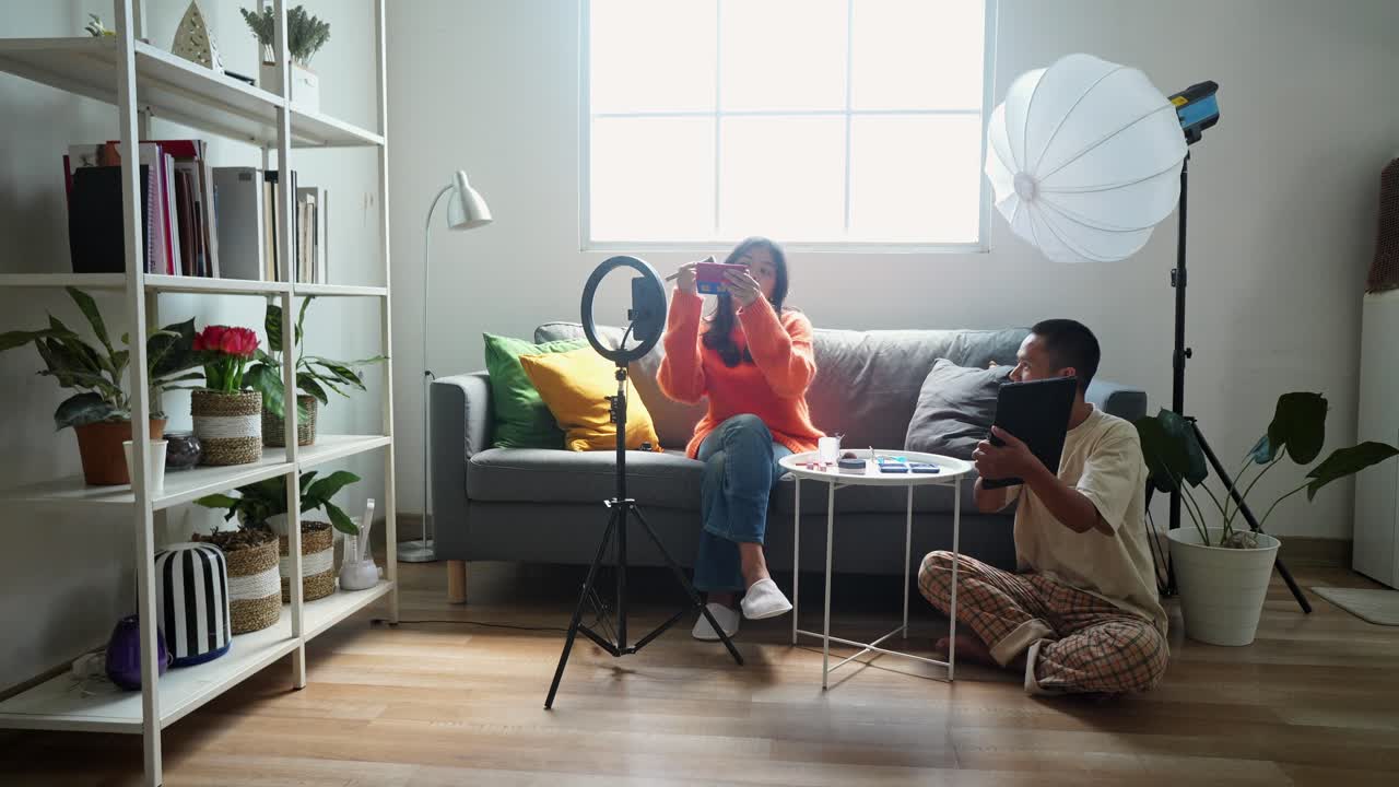 Couple Filming a Makeup Tutorial Video at Home