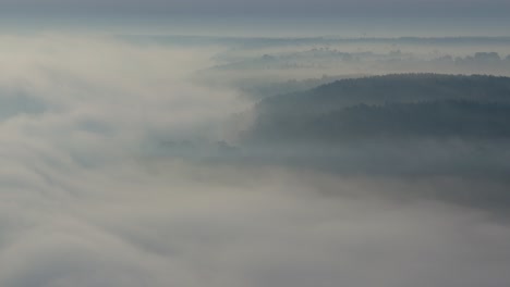 heavy fog over the nemunas river in kaunas county, lithuania. drone aerial view. autumn morning