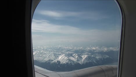view of mountain outside plane window