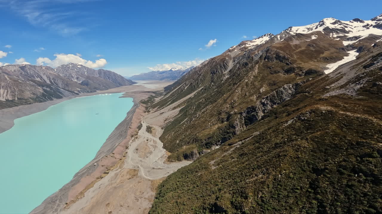 Helicopter POV shot flying past the Tasman Lake, New Zealand