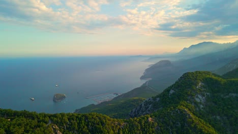 aerial 4k drone video of a rat island near tunektepe teleferik
cable station positioned on top of the hill with the mountains in the background