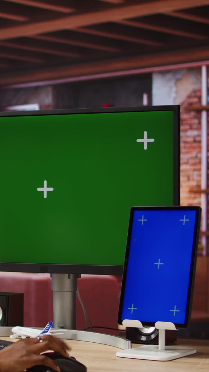 Vertical video Remote employee in home office using green screen PC and mockup tablet