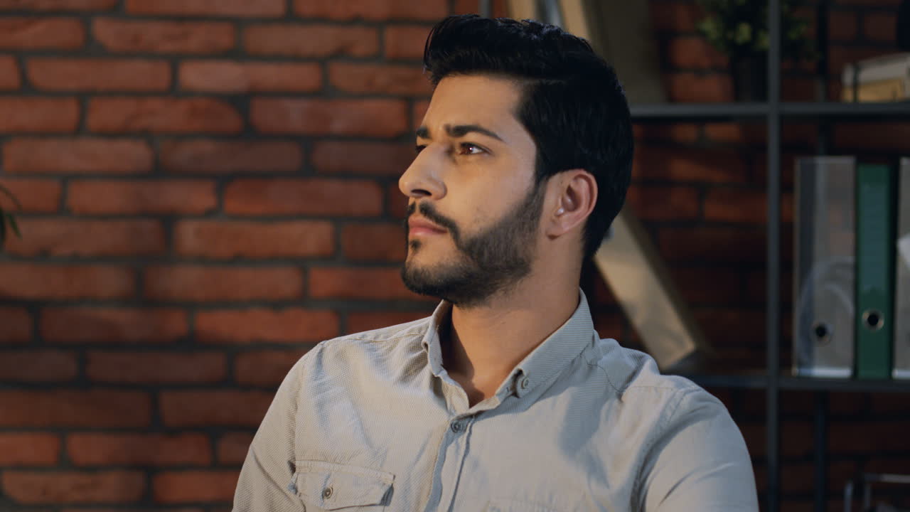 Arabian Businessman Turning His Head To The Camera And Smiling Cheerfully