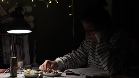 a girl writing at night