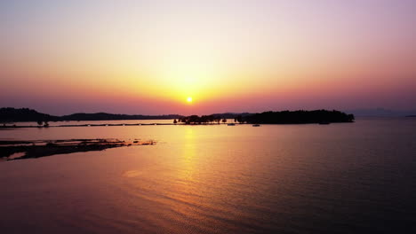 Beautiful Sunset Over Calm Ocean with Islands