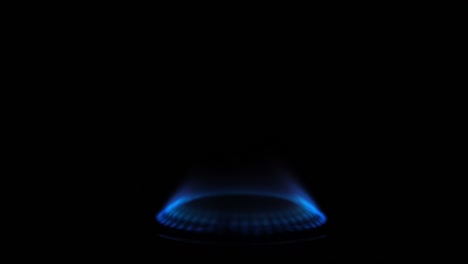 gas stove being turned on isolated on black background. natural gas deficit concept. 4k resolution video