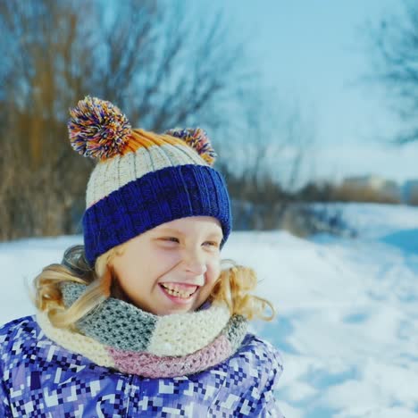 Girl-5-Years-Enjoys-Winter---Throws-Snow