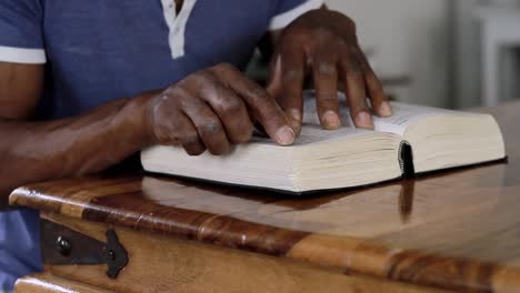 man-praying-to-God-with-hand-on-bible-with-people-stock-video-stock-footage