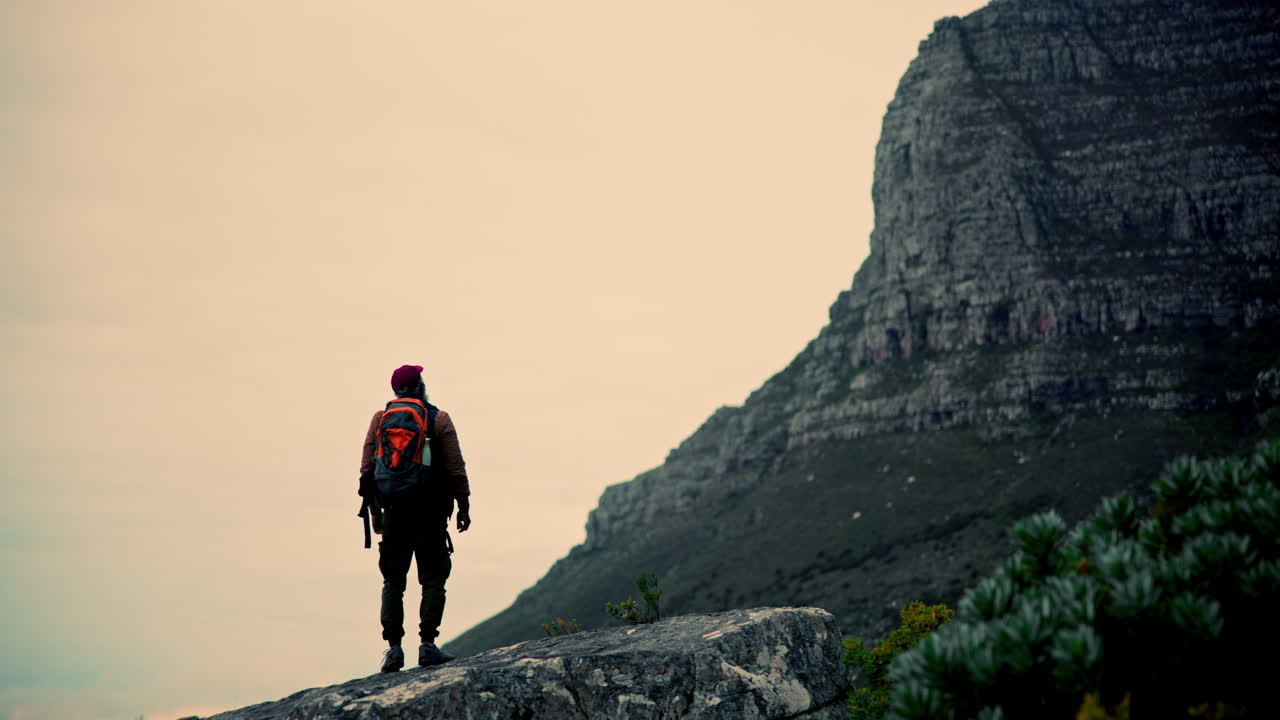 A hiker admiring a mountain
