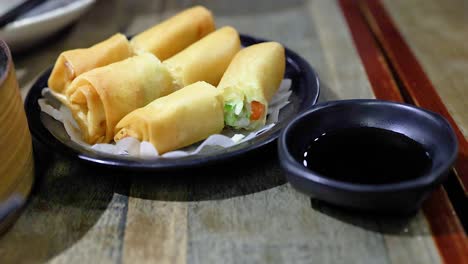 delicious fried spring rolls with soy sauce