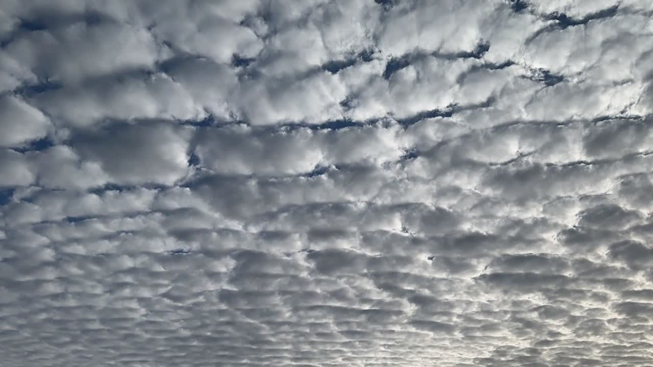 Stratocumulus cloud formations moving across the sky (time-lapse) showing extreme levels of CO2 (greenhouse gases) creating a dangerous tipping point scenario for global warming and climate change