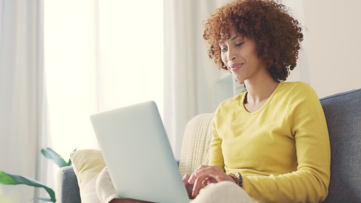 An african american working remotely on a laptop