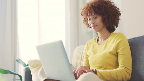 an african american working remotely on a laptop