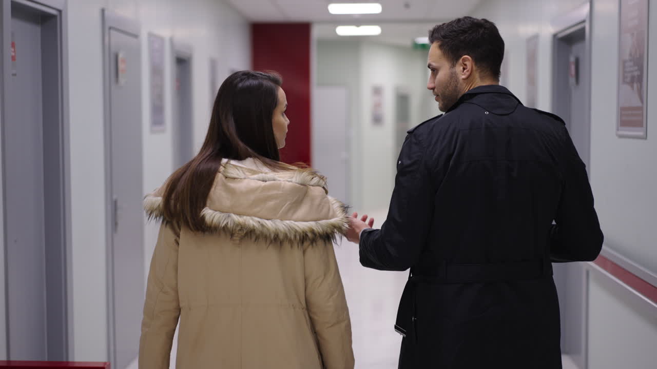 People walking in a hospital hallway