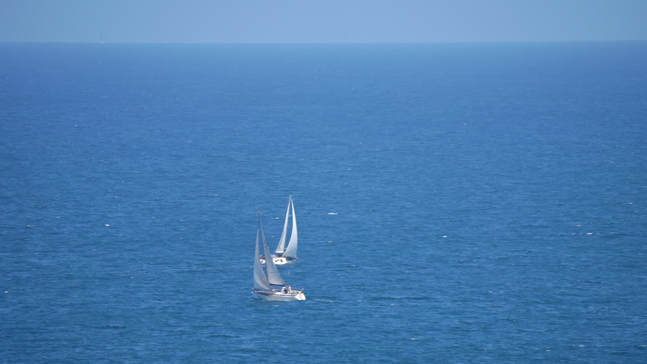 Two Sailboats on the Open Sea