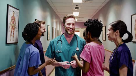 happy medical team in hospital corridor