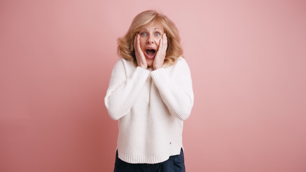 Middle-Aged Woman Reacting with Surprise and then Happiness