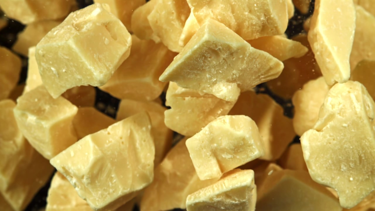 Super Slow Motion of Cocoa Butter Chunks Falling