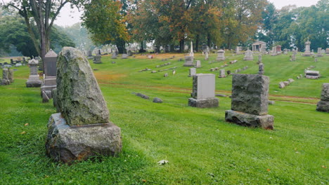 cemetery gravestones on green grass