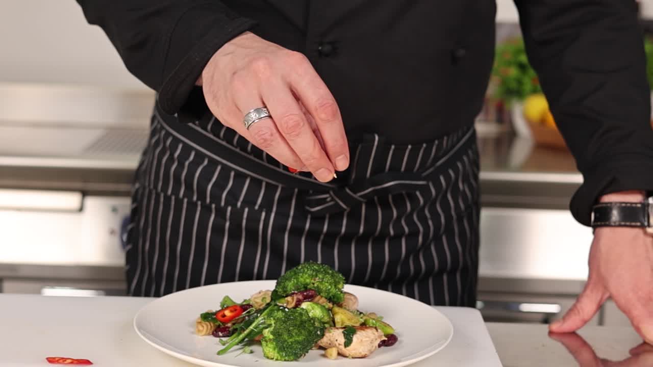 Chef Preparing a Delicious Chicken and Vegetable Pasta Dish