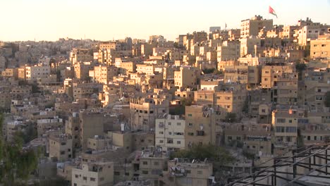houses cluster together on the hillsides of amman jordan