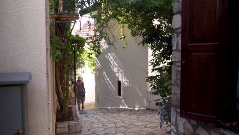 the shot depicts a narrow cobblestone street surrounded by quaint old houses in marmaris, tukey