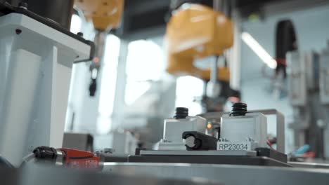 robotic arms working on a production line at automotive factory