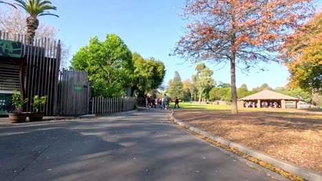 visitors walking along a scenic zoo pathway