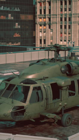 military black hawk helicopter on rooftop in a city