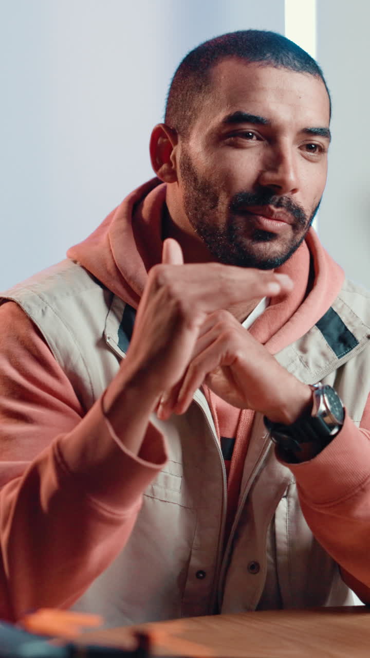 Portrait of a man with a beard and hoodie