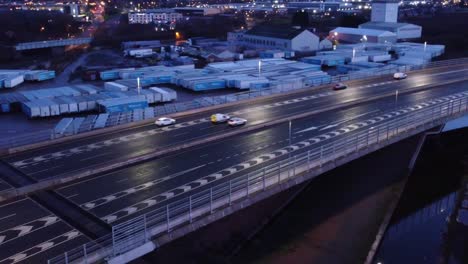 aerial view modern illuminated quiet highway lanes road intersection traffic birdseye orbit left