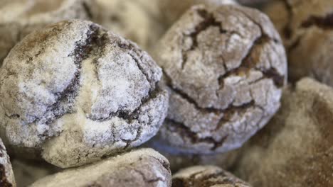 close up of delicious chocolate cookies covered in powdered sugar