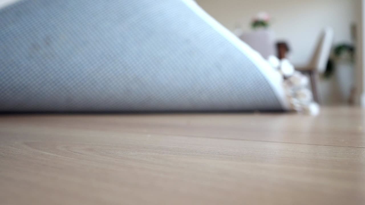 Close-up view of carpets on wooden floor