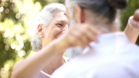 hugging in park, senior couple sharing warm embrace at outdoor wedding