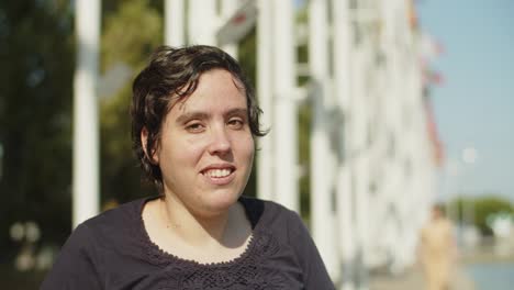 portrait of young happy woman looking at camera and smiling