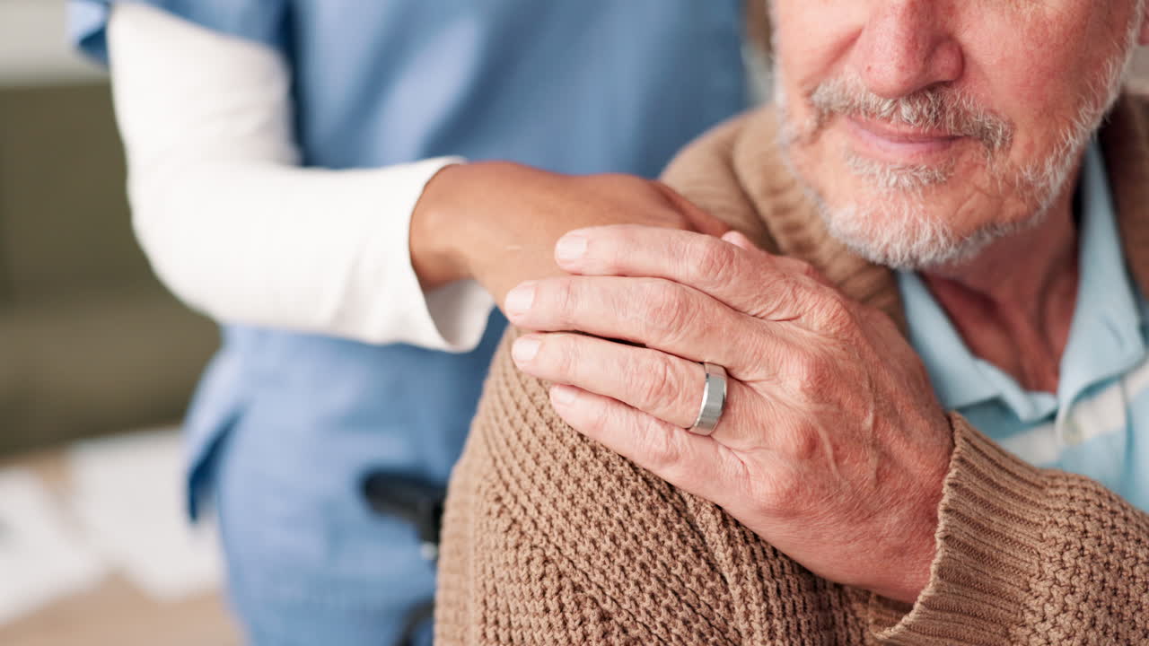 Caregiver supporting senior man