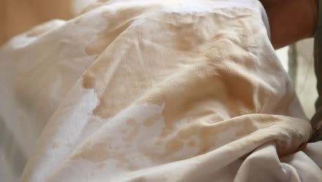 close up of a coffee stain on a white shirt