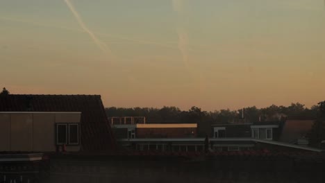 early morning sunrise over rooftops in a dutch suburban neighbourhood!